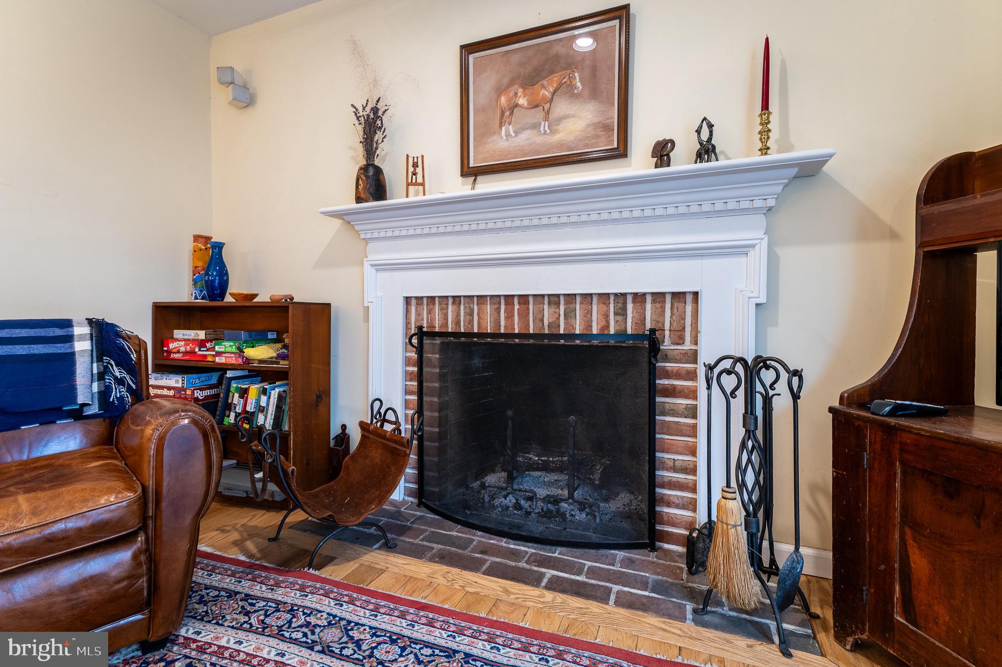 12 Phillips Lane Chester Springs, PA 19425 - Photo 28 of 54 a living room with furniture a flat screen tv and a fireplace