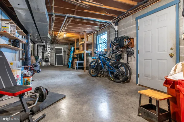 a aerial view of a house next to a yard