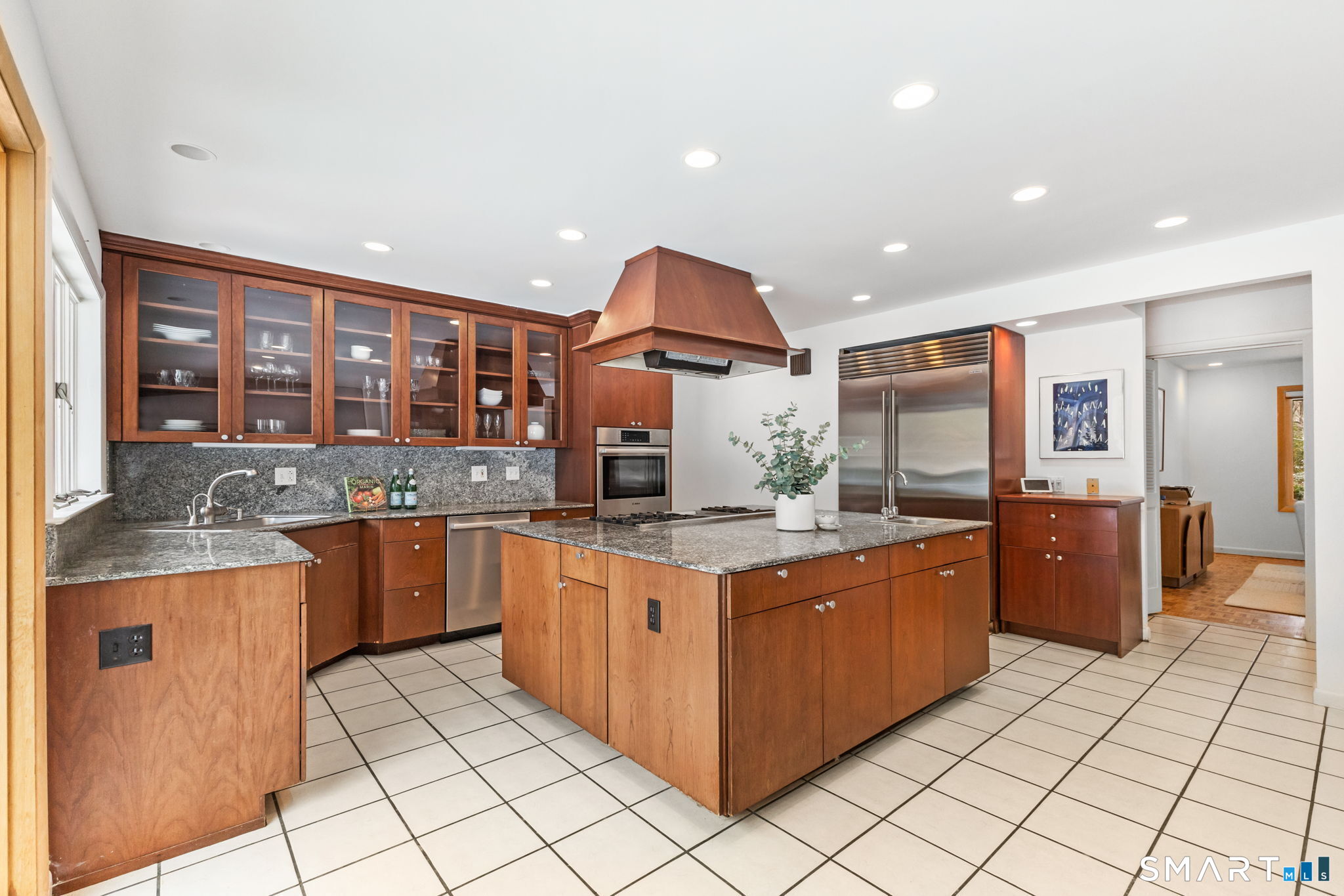 37 Quarry Road Stamford, CT 06903 - Photo 10 of 41 a kitchen with stainless steel appliances granite countertop a stove and cabinets