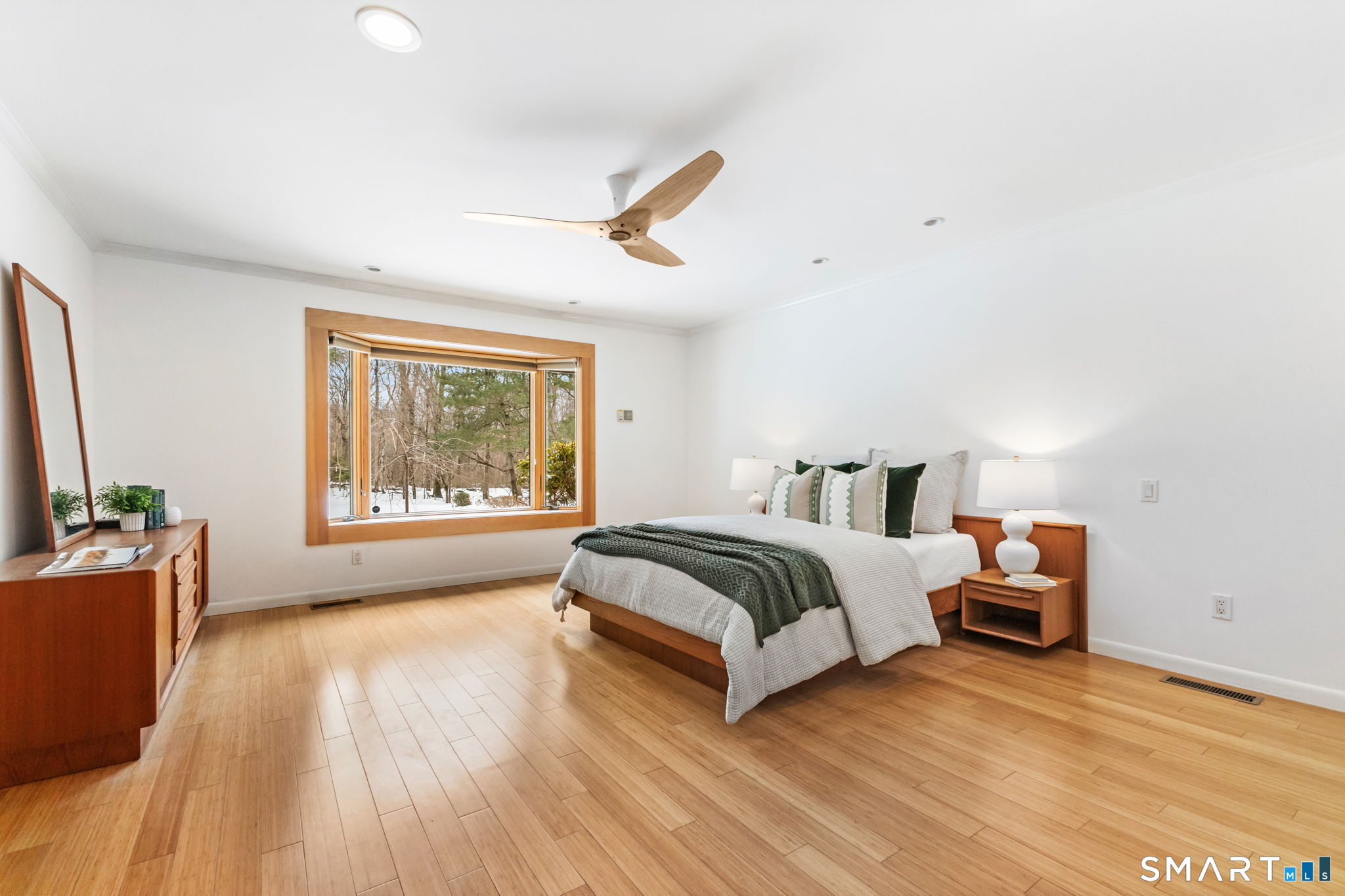 37 Quarry Road Stamford, CT 06903 - Photo 16 of 41 a spacious bedroom with a bed and wooden floor