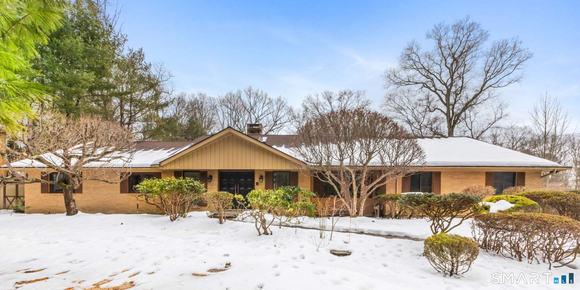 37 Quarry Road Stamford, CT 06903 - Photo 2 of 41 a front view of a house with a yard covered in snow