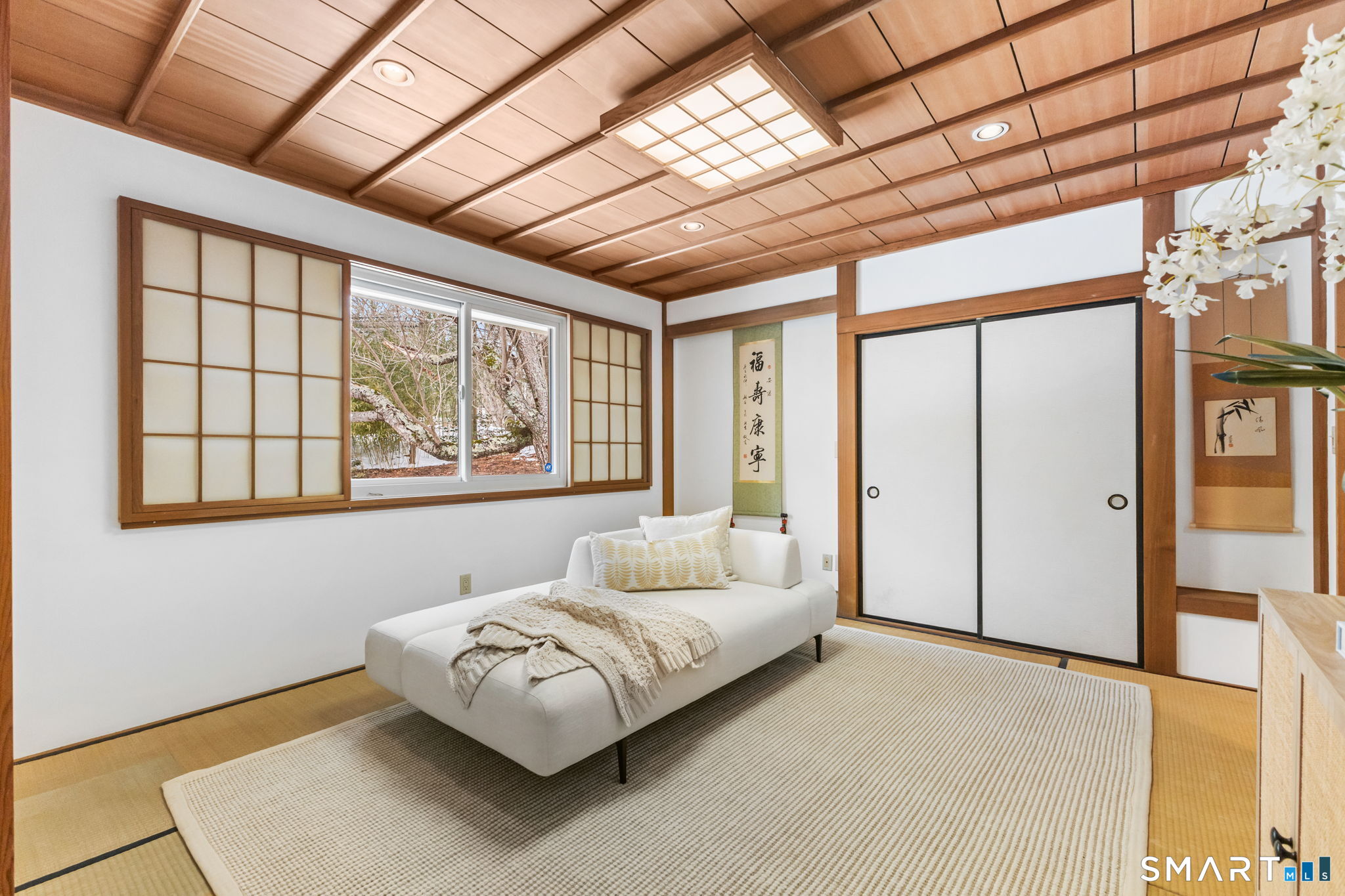 37 Quarry Road Stamford, CT 06903 - Photo 22 of 41 a bedroom with a large bed and a large window