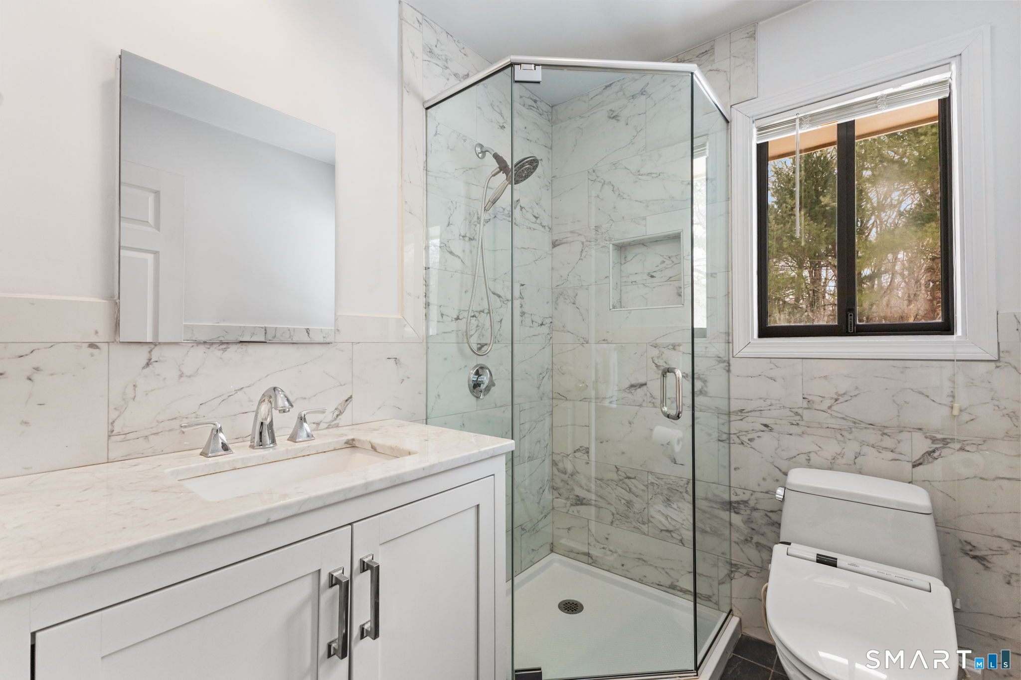 37 Quarry Road Stamford, CT 06903 - Photo 27 of 41 a bathroom with a shower sink vanity mirror and toilet