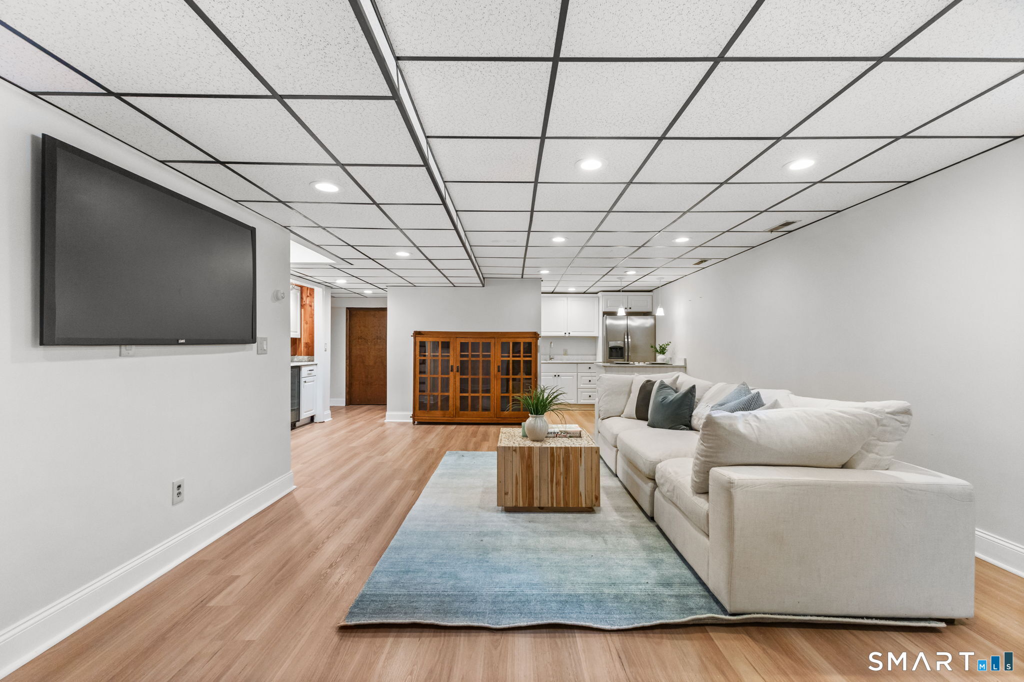 37 Quarry Road Stamford, CT 06903 - Photo 28 of 41 a living room with furniture and a flat screen tv