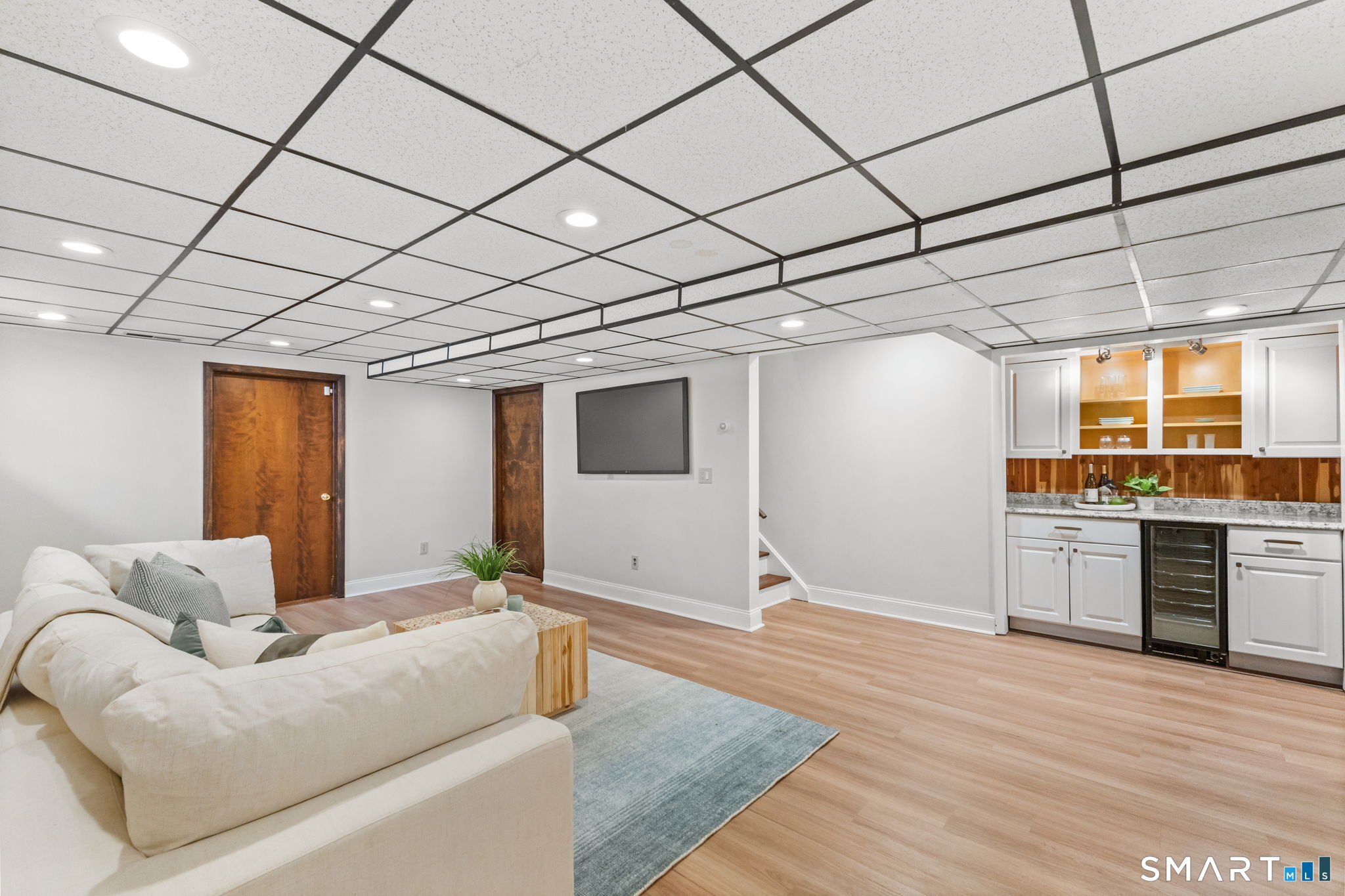 37 Quarry Road Stamford, CT 06903 - Photo 30 of 41 a living room with granite countertop furniture and a wooden floor
