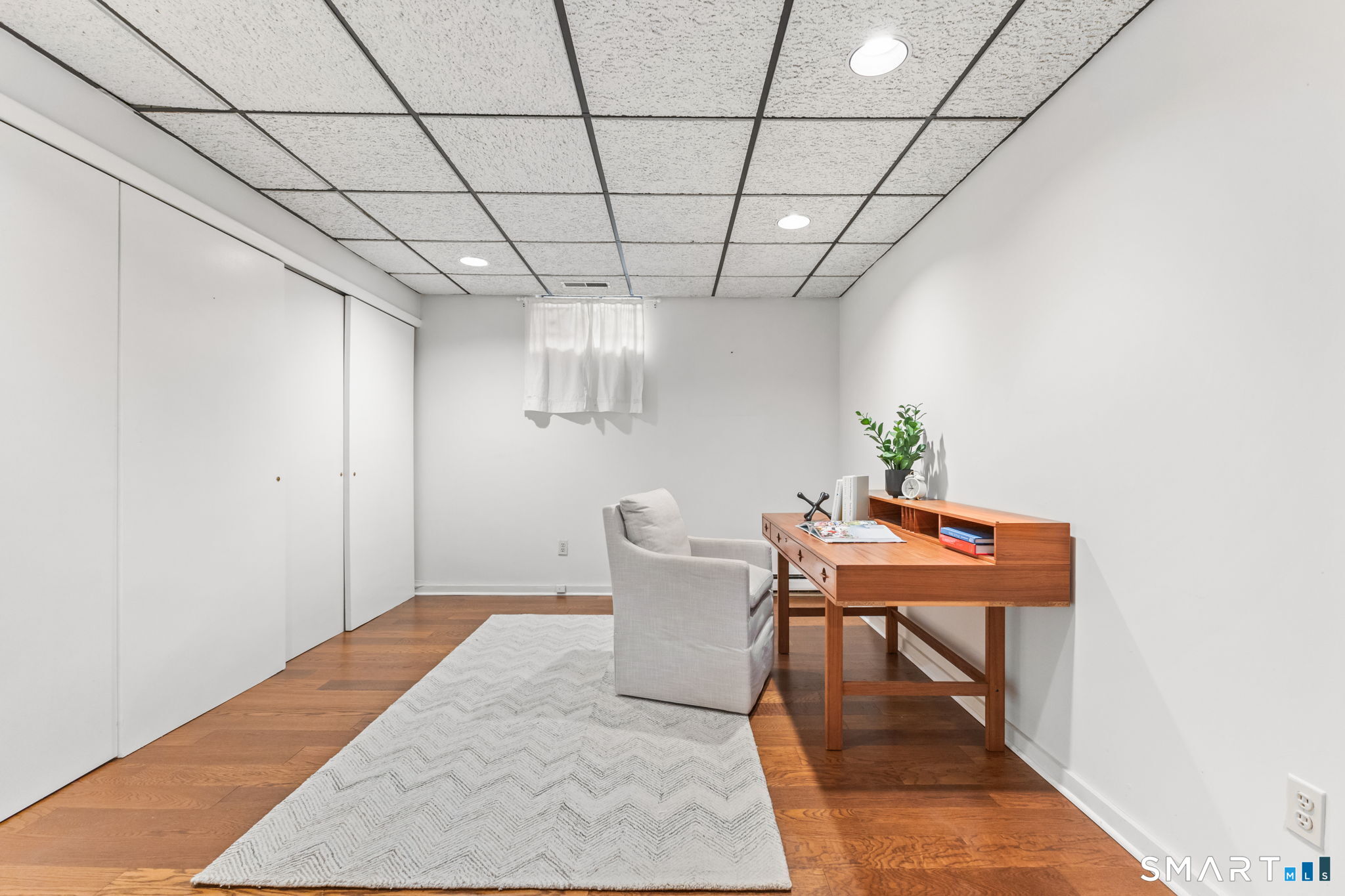 37 Quarry Road Stamford, CT 06903 - Photo 31 of 41 a room with furniture and a chandelier