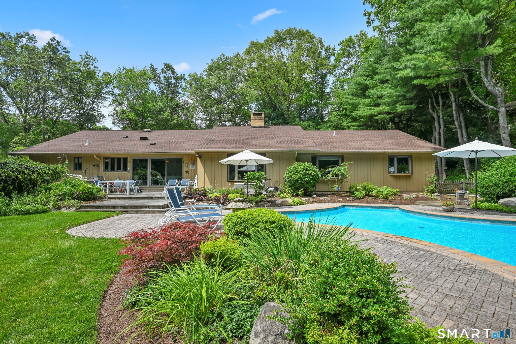 37 Quarry Road Stamford, CT 06903 - Photo 33 of 41 a view of a house with swimming pool and sitting area