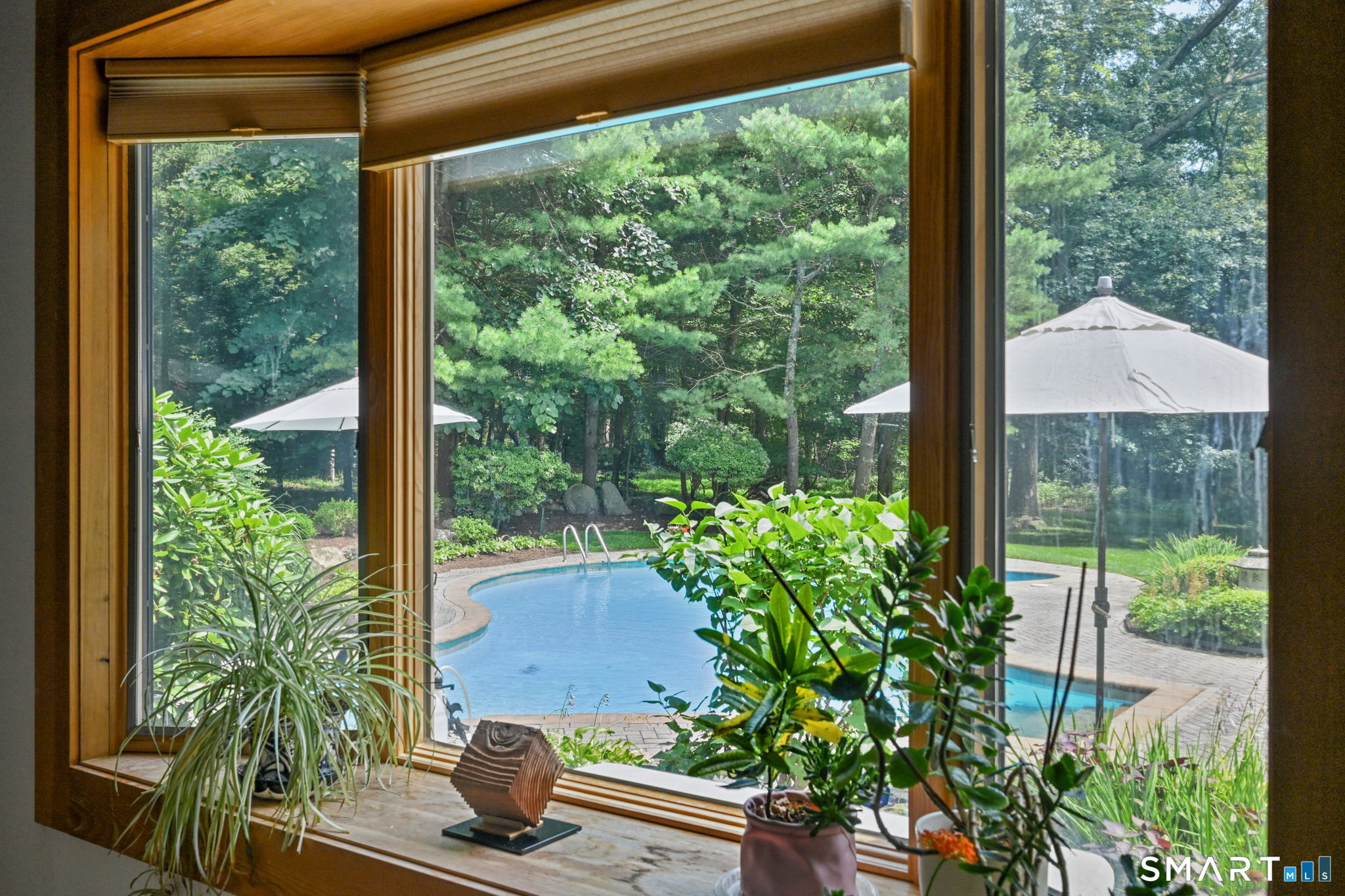37 Quarry Road Stamford, CT 06903 - Photo 36 of 41 a view of a garden with a chair and table in the patio