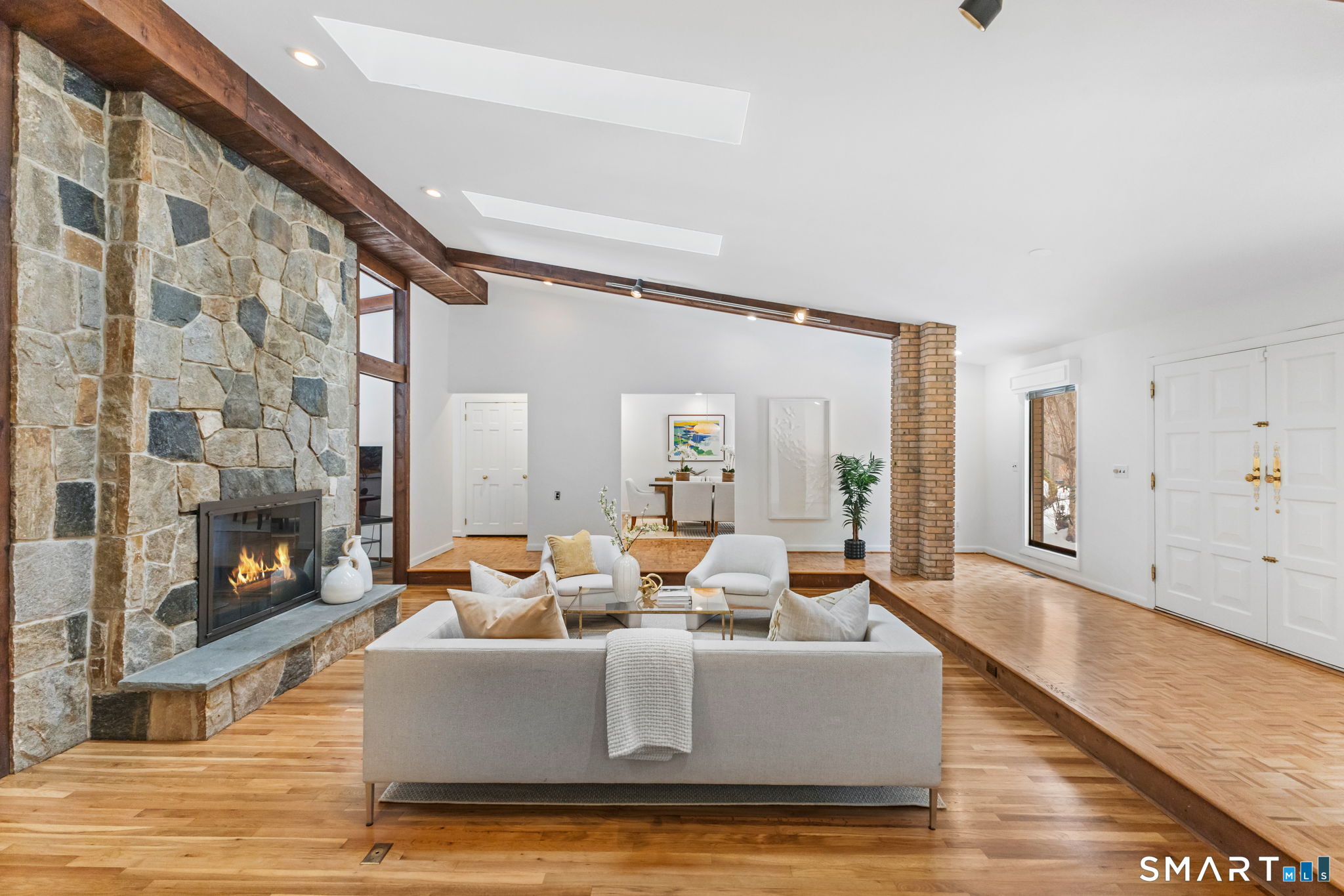 37 Quarry Road Stamford, CT 06903 - Photo 39 of 41 a living room with fireplace furniture and a floor to ceiling window