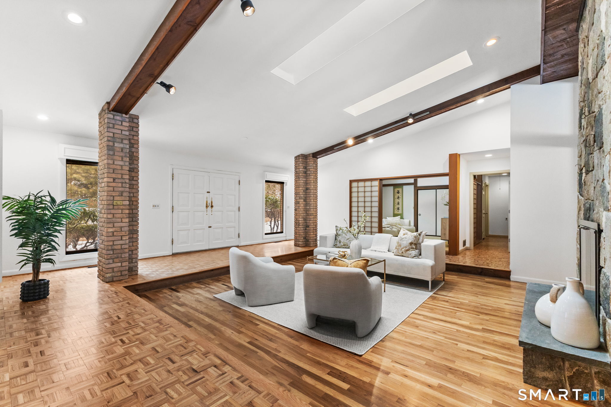 37 Quarry Road Stamford, CT 06903 - Photo 5 of 41 a living room with furniture and wooden floor