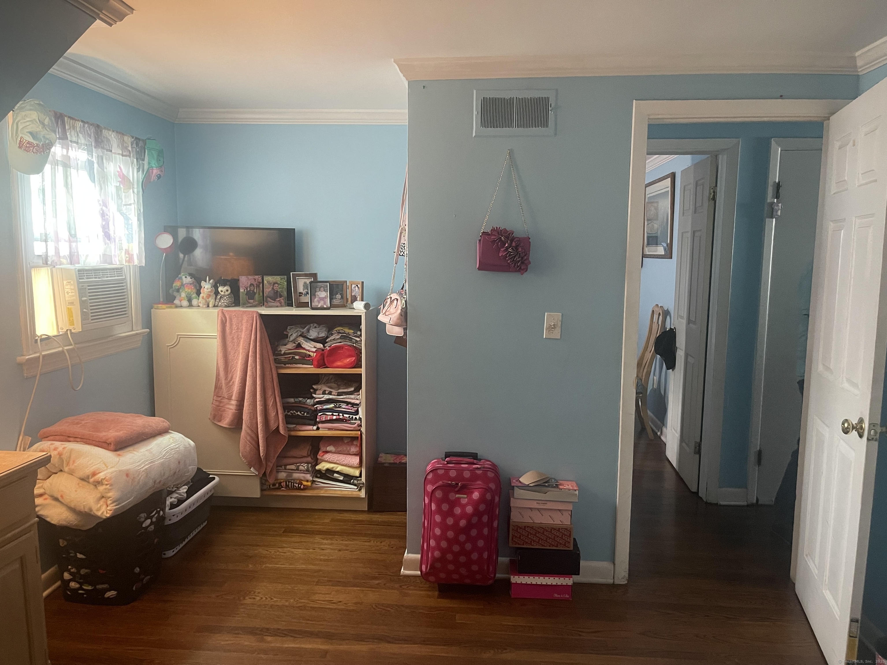 95 Frederick Street Stamford, CT 06902 - Photo 20 of 30 a bedroom with a bed and wooden floor