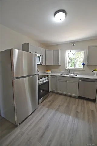 a view of a yard with a house and a tree
