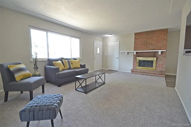 a kitchen with stainless steel appliances granite countertop a refrigerator sink and wooden floor