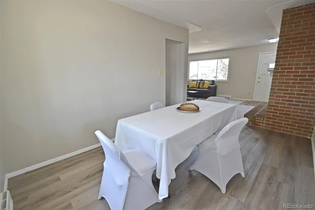 a bathroom with a sink a toilet and shower curtain