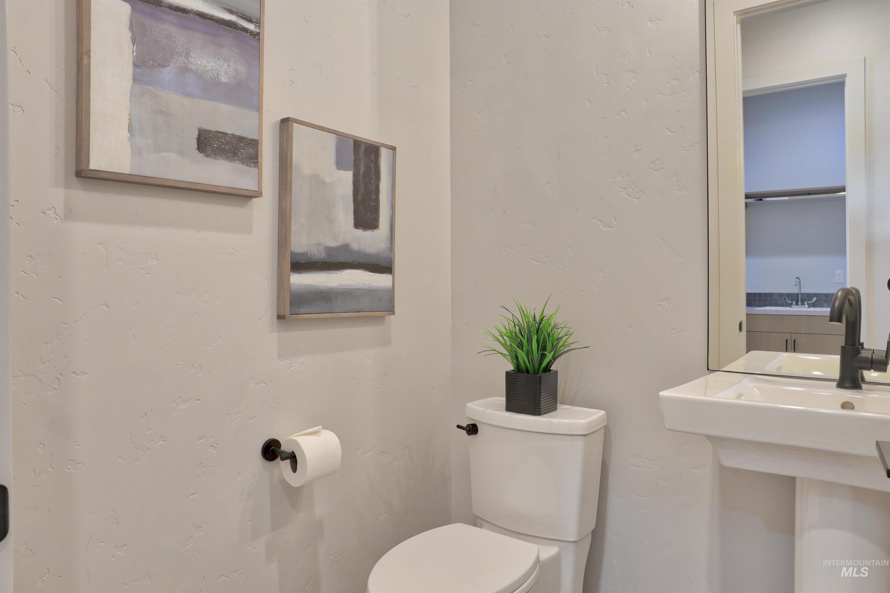 4148 East Copper Point Drive Meridian, ID 83642 - Photo 18 of 26 Bathroom with a textured wall and toilet