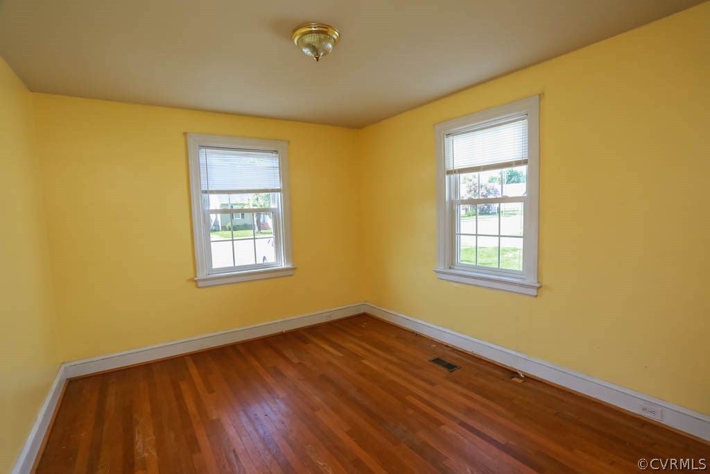 1806 Hilliard Road Henrico, VA 23228 - Photo 15 of 28 a view of an empty room with wooden floor and a window