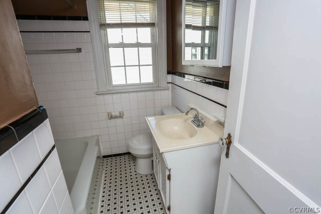 1806 Hilliard Road Henrico, VA 23228 - Photo 17 of 28 a bathroom with a sink toilet and window
