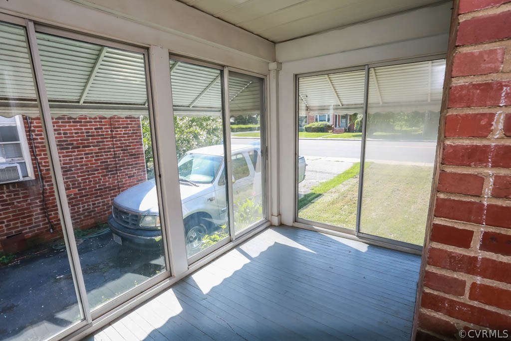 1806 Hilliard Road Henrico, VA 23228 - Photo 23 of 28 a view of an empty room with wooden floor and a window