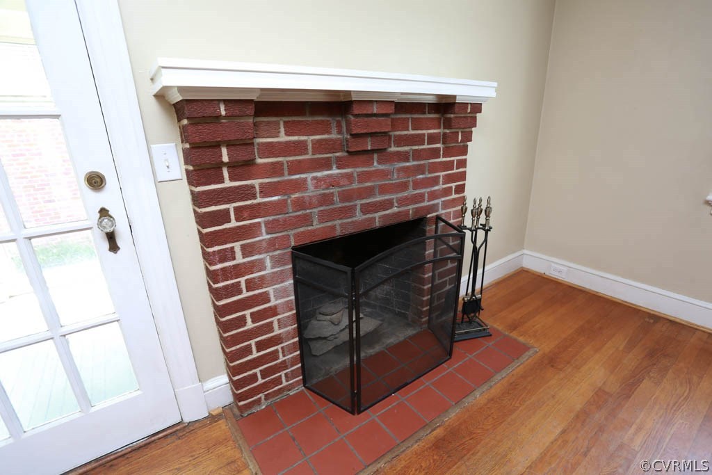 1806 Hilliard Road Henrico, VA 23228 - Photo 3 of 28 a living room with wooden floor and a fireplace
