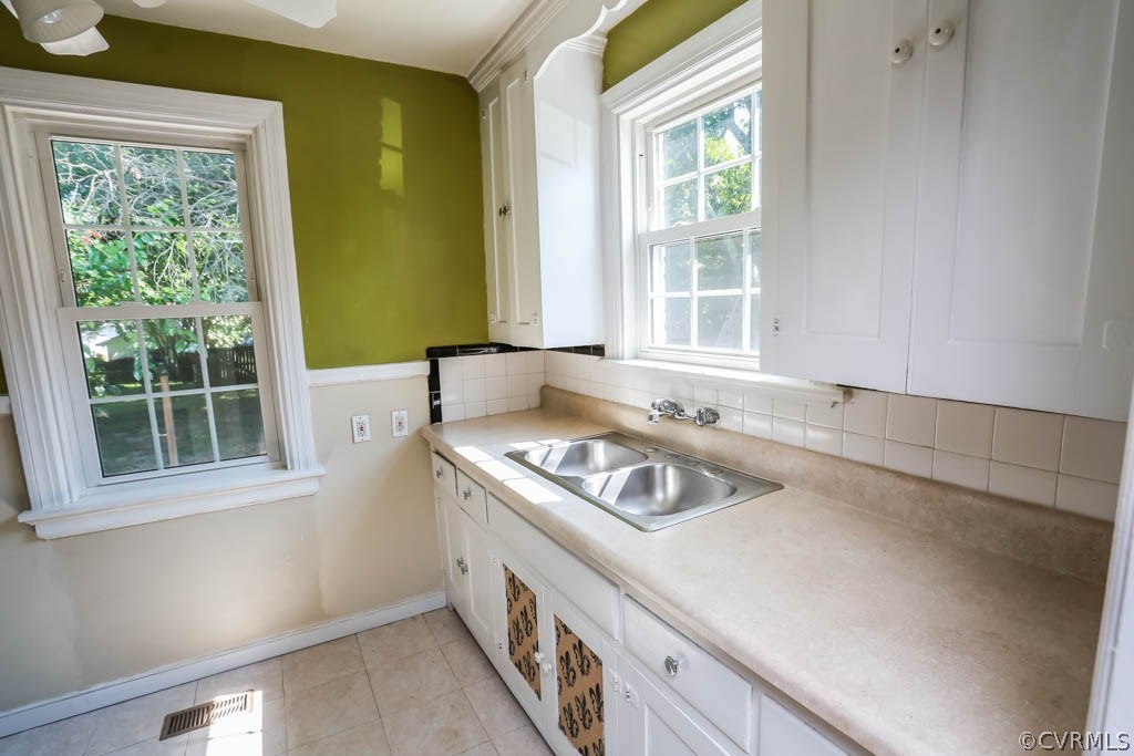 1806 Hilliard Road Henrico, VA 23228 - Photo 10 of 28 a kitchen with a window cabinets and a stove top oven