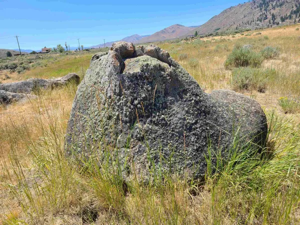 a view of ocean with a mountain