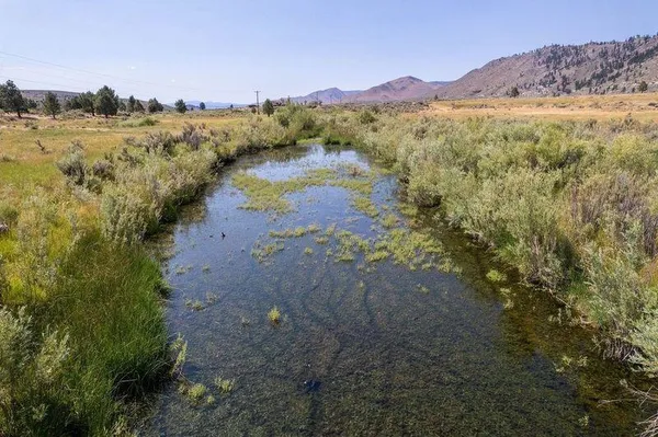 a view of a lake with mountains in the background