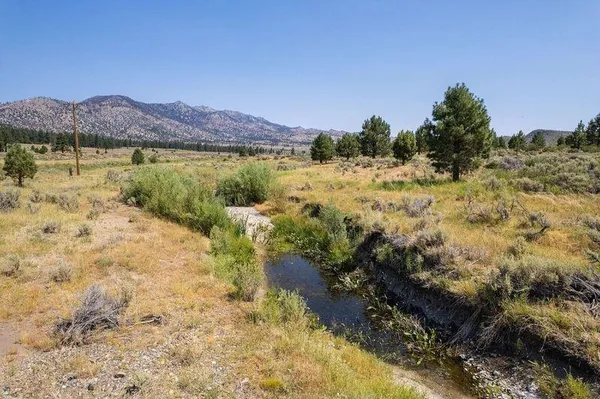 a view of lake with mountain in the background