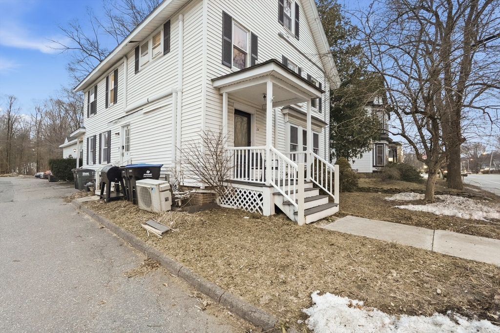 72 Main Street Pepperell, MA 01463 - Photo 3 of 26 a view of a house with a yard patio and a yard