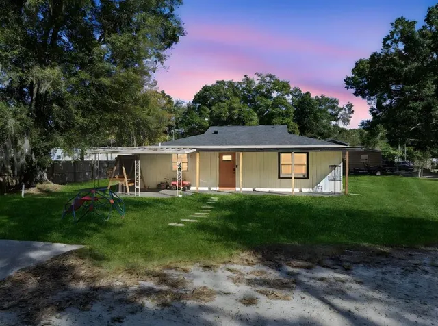 a view of a back yard of the house