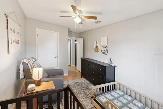 a view of a workspace with furniture and wooden floor