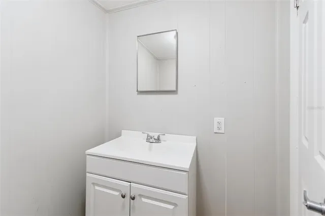 a view of a house with a yard balcony and sitting area