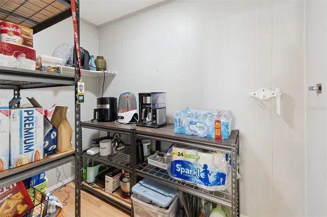 a bedroom with a bed and a large mirror