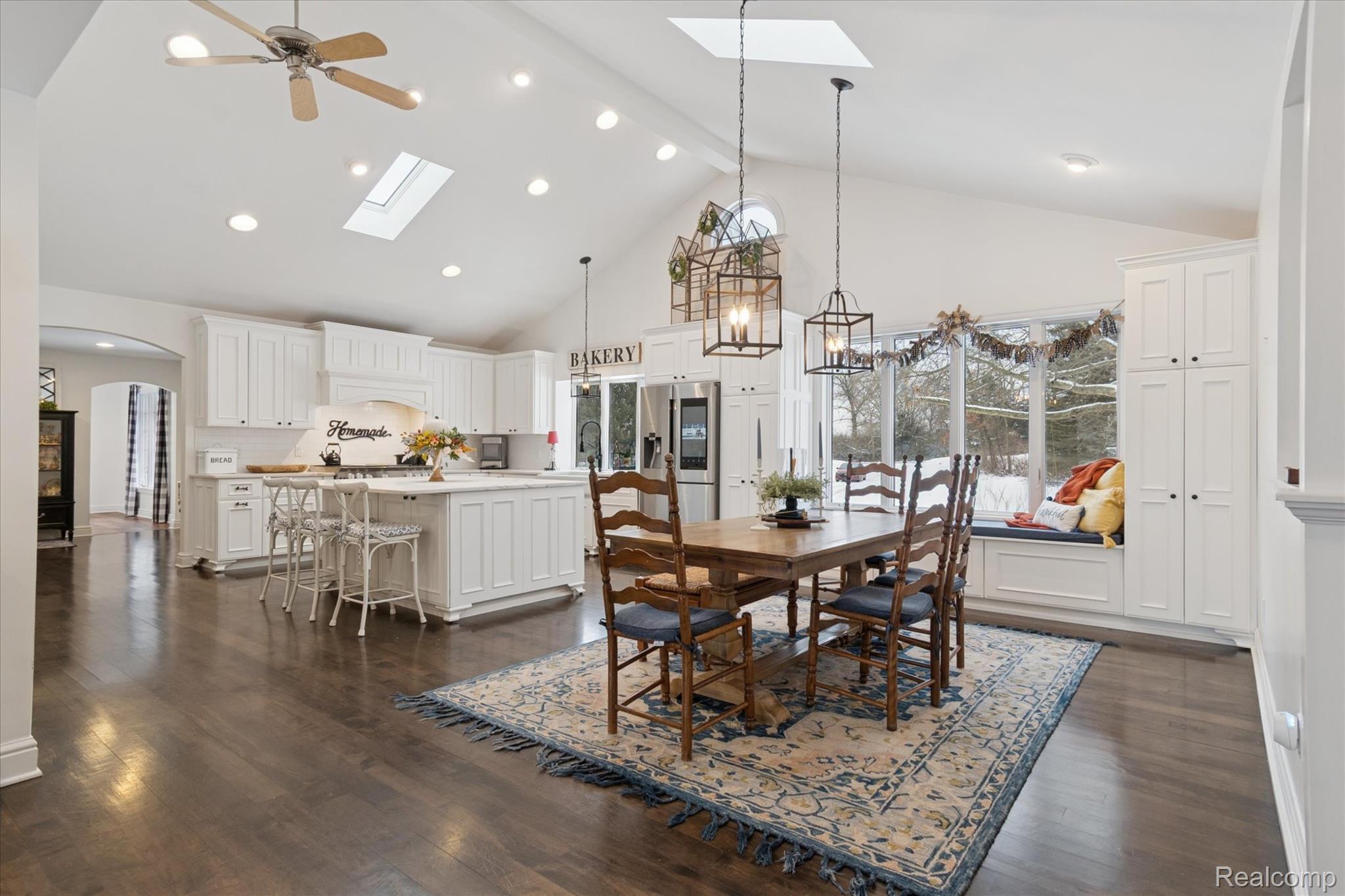 187 Darwin Road Pinckney, MI 48169 - Photo 21 of 71 Eat-in Dining area with high vaulted ceiling, arched walkways, recessed lighting, skylight