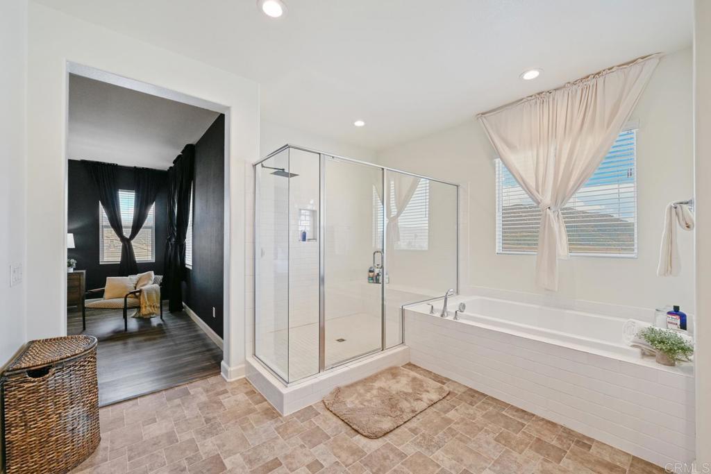 4634 Silent Knoll Drive Fallbrook, CA 92028 - Photo 21 of 26 a spacious bathroom with a tub shower and mirror
