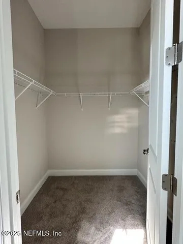 a view of an empty walk in closet
