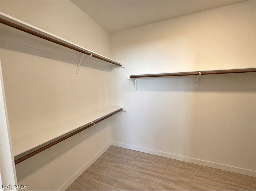 2555 Hampton Road, Unit 4205 Henderson, NV 89052 - Photo 28 of 52 This spacious walk-in closet offers ample storage and a neutral palette.