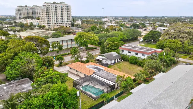 an aerial view of a city with lake view