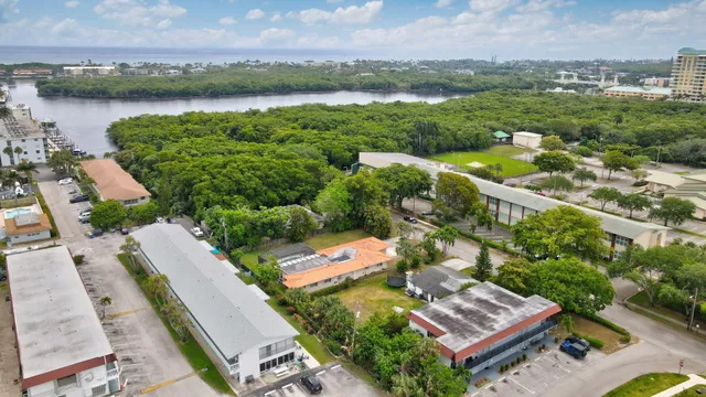 a view of a house with a yard patio and swimming pool
