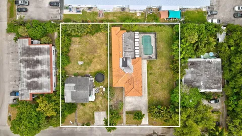 aerial view of a house with a garden