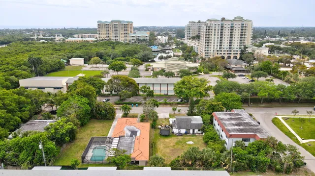 an aerial view of a house with garden space and street view