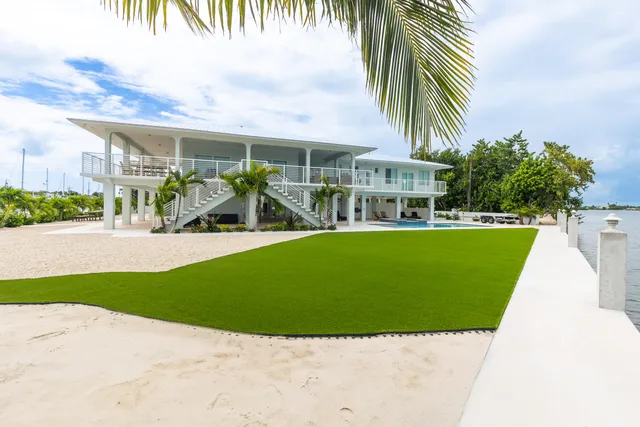a living room with furniture potted plant and a window