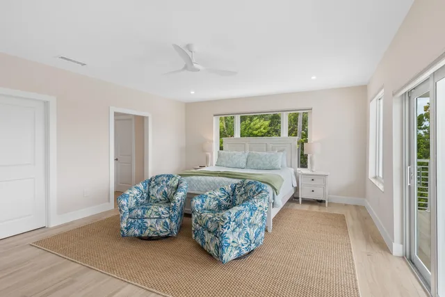 a bedroom with a bed and a night stand