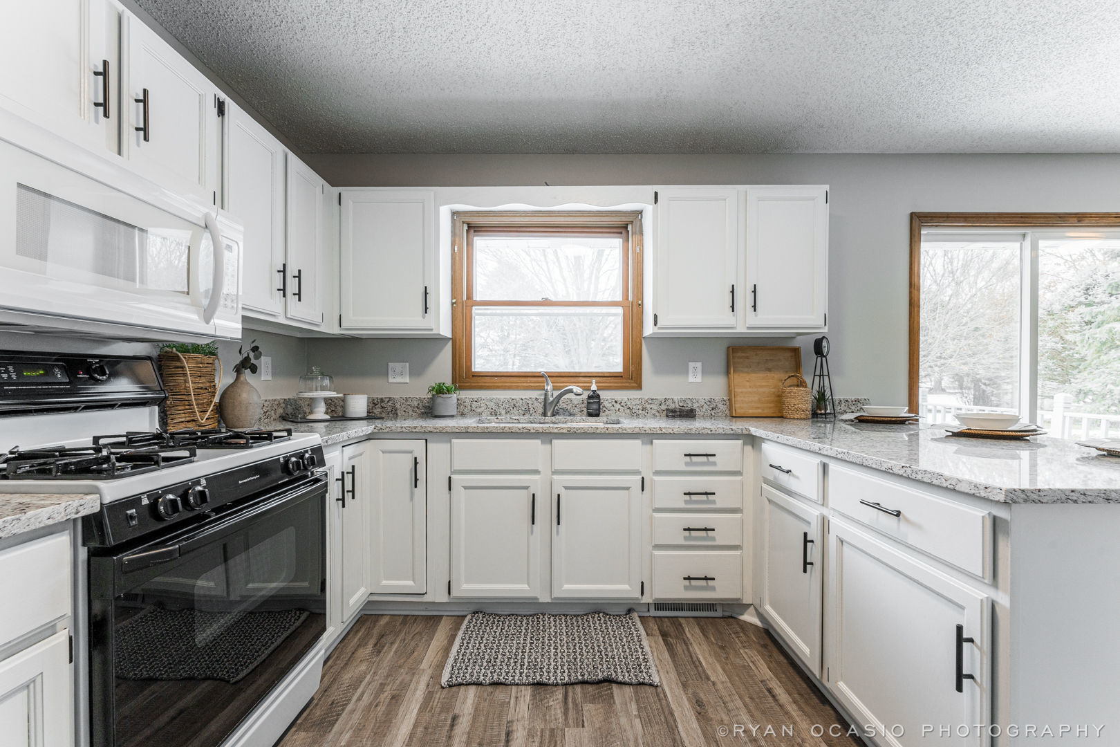 403 Maple Avenue Maple Park, IL 60151 - Photo 11 of 20 a kitchen with cabinets appliances a sink and a window
