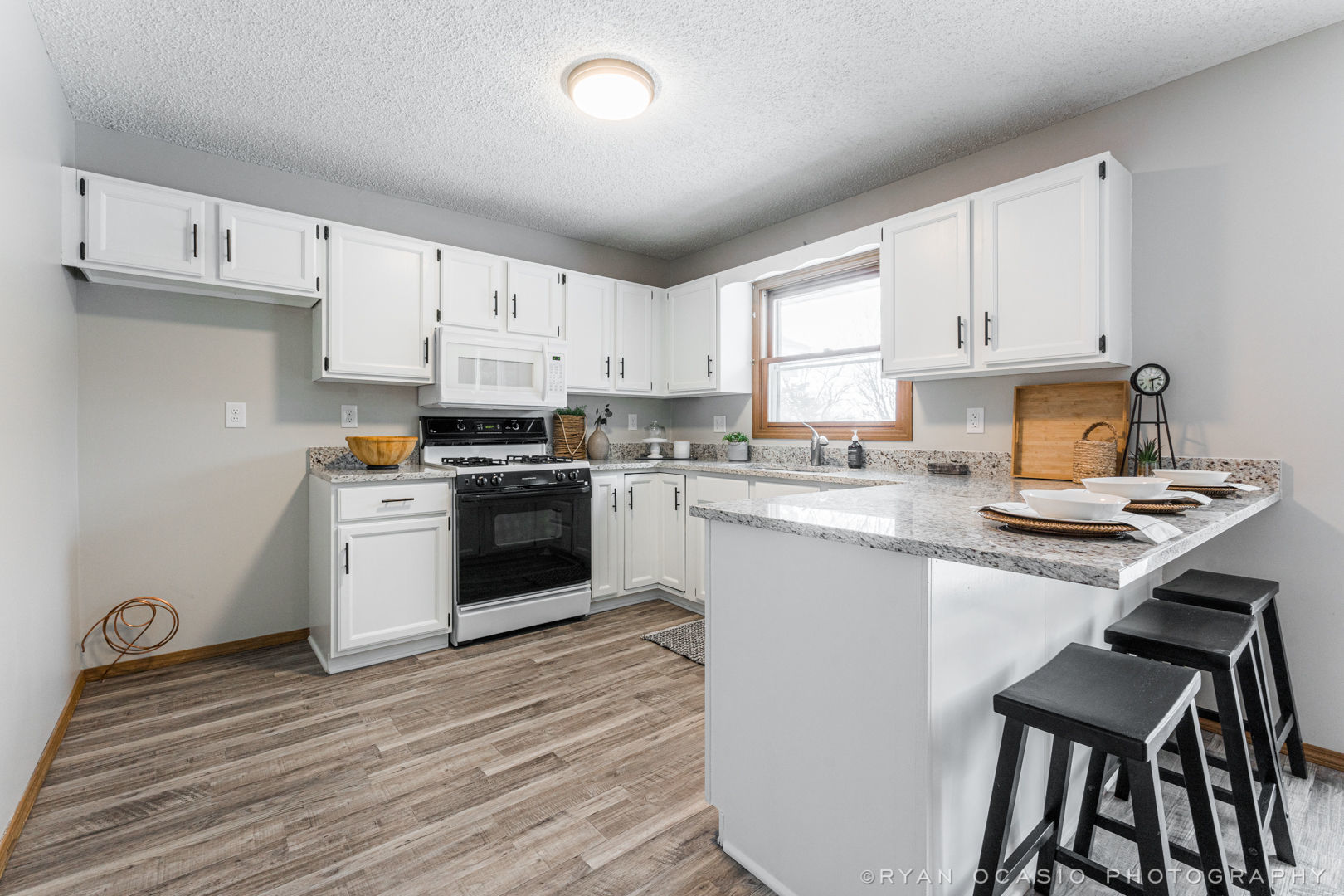 403 Maple Avenue Maple Park, IL 60151 - Photo 10 of 20 a kitchen with granite countertop white cabinets and white appliances