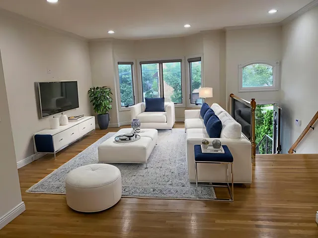 a living room with fireplace furniture and a flat screen tv
