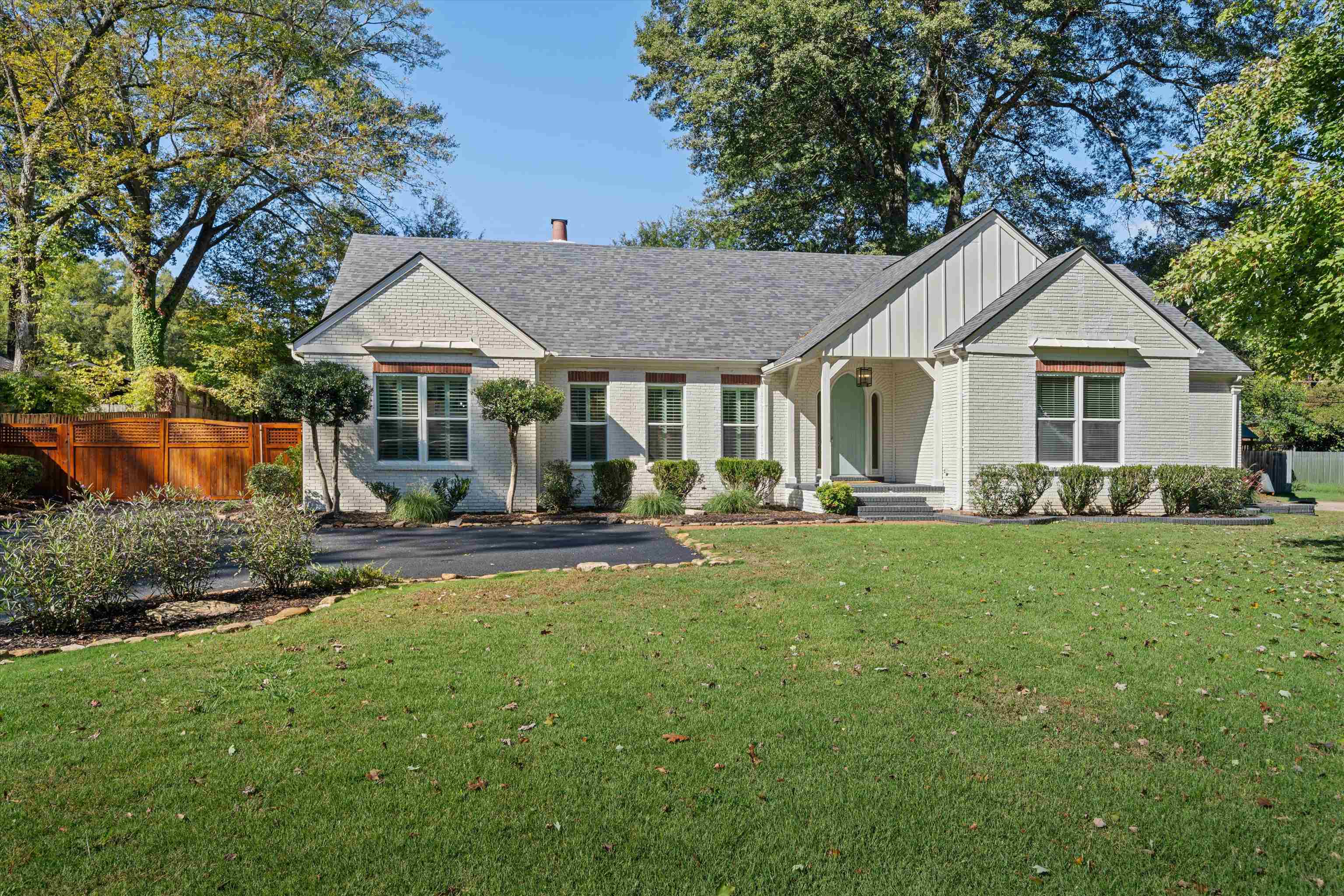 159 Perkins Extension Memphis, TN 38117 - Photo 1 of 37 a view of a house with backyard sitting area and garden
