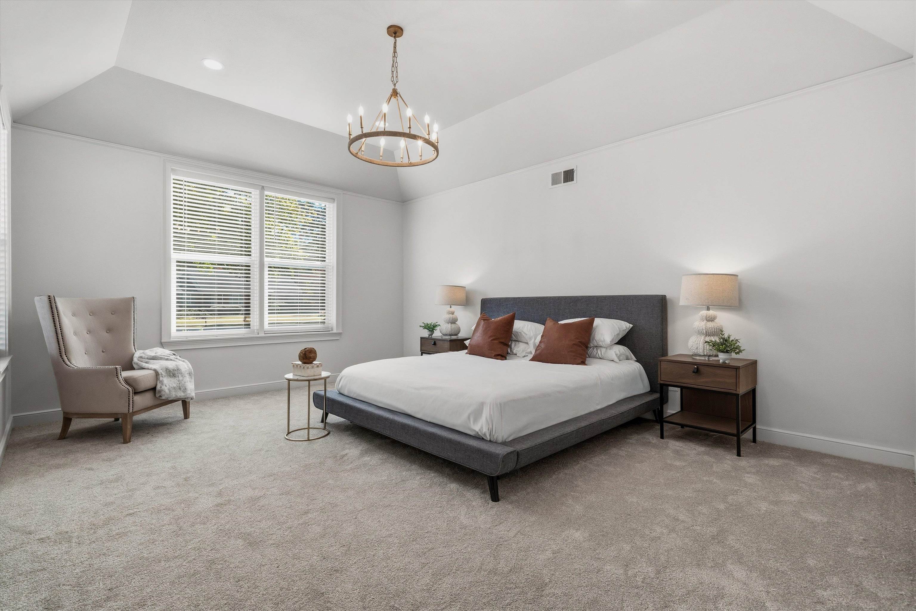 159 Perkins Extension Memphis, TN 38117 - Photo 18 of 37 a spacious bedroom with a bed and a window