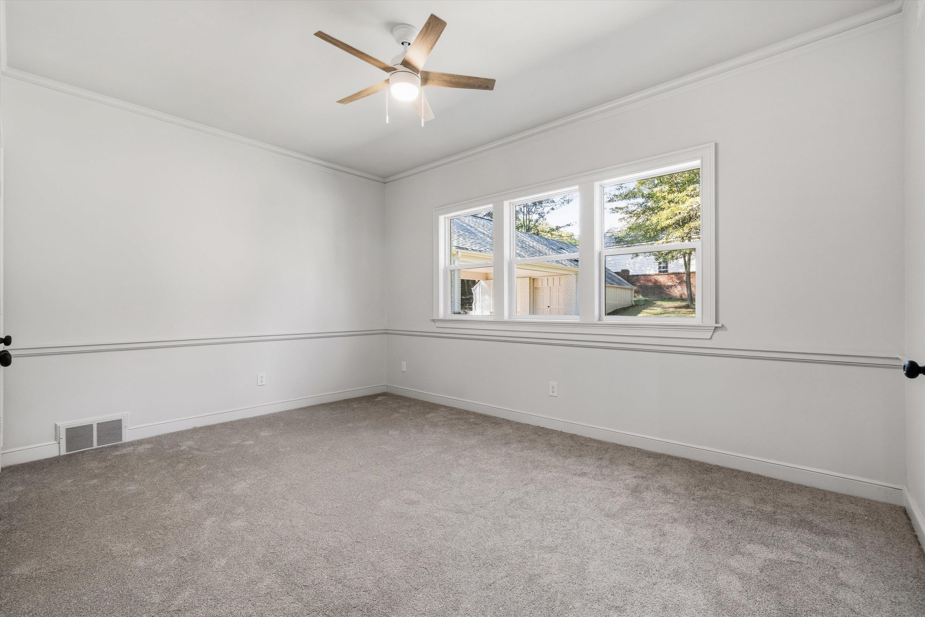 159 Perkins Extension Memphis, TN 38117 - Photo 26 of 37 a view of an empty room with a window