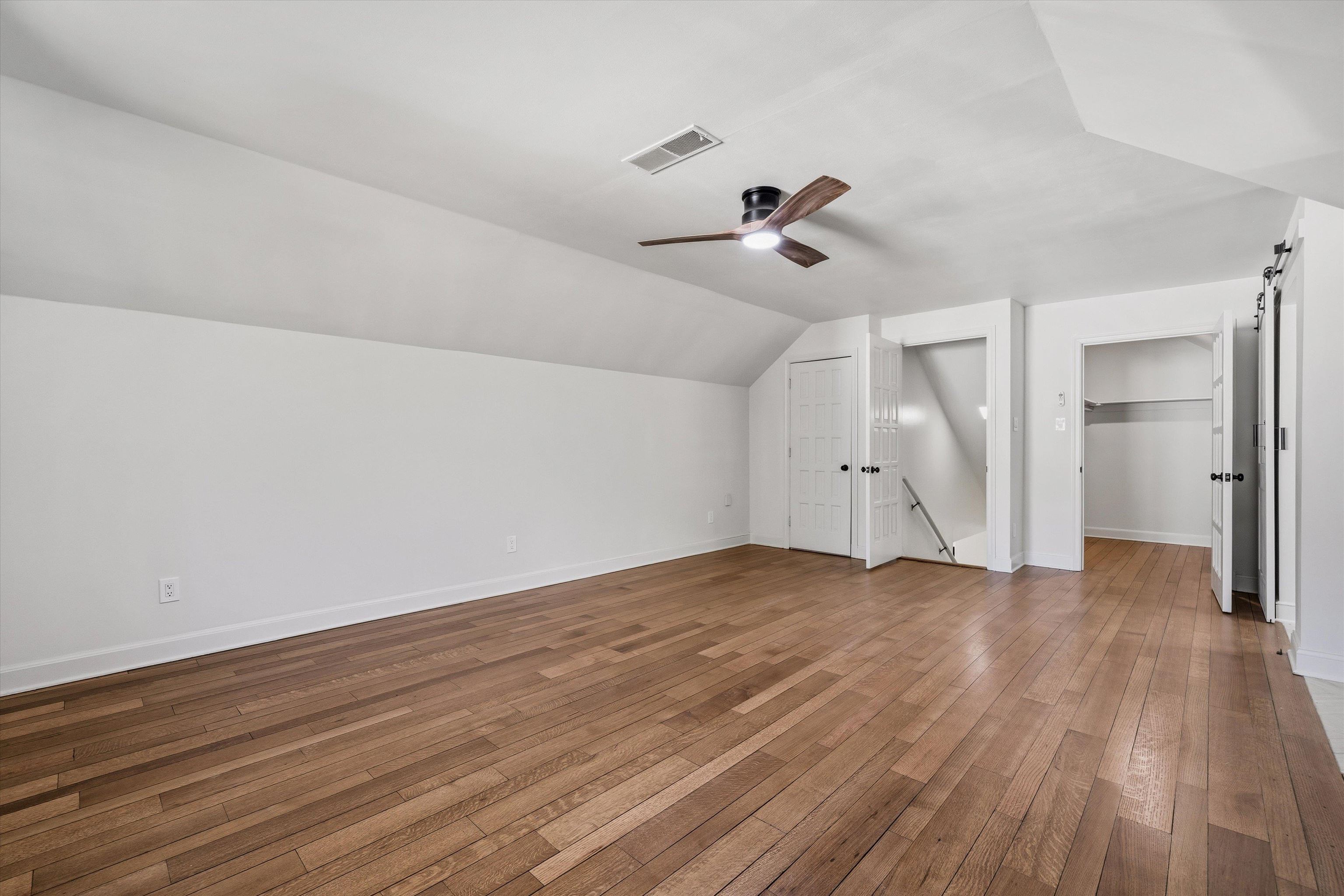 159 Perkins Extension Memphis, TN 38117 - Photo 29 of 37 a view of empty room with wooden floor and ceiling fan