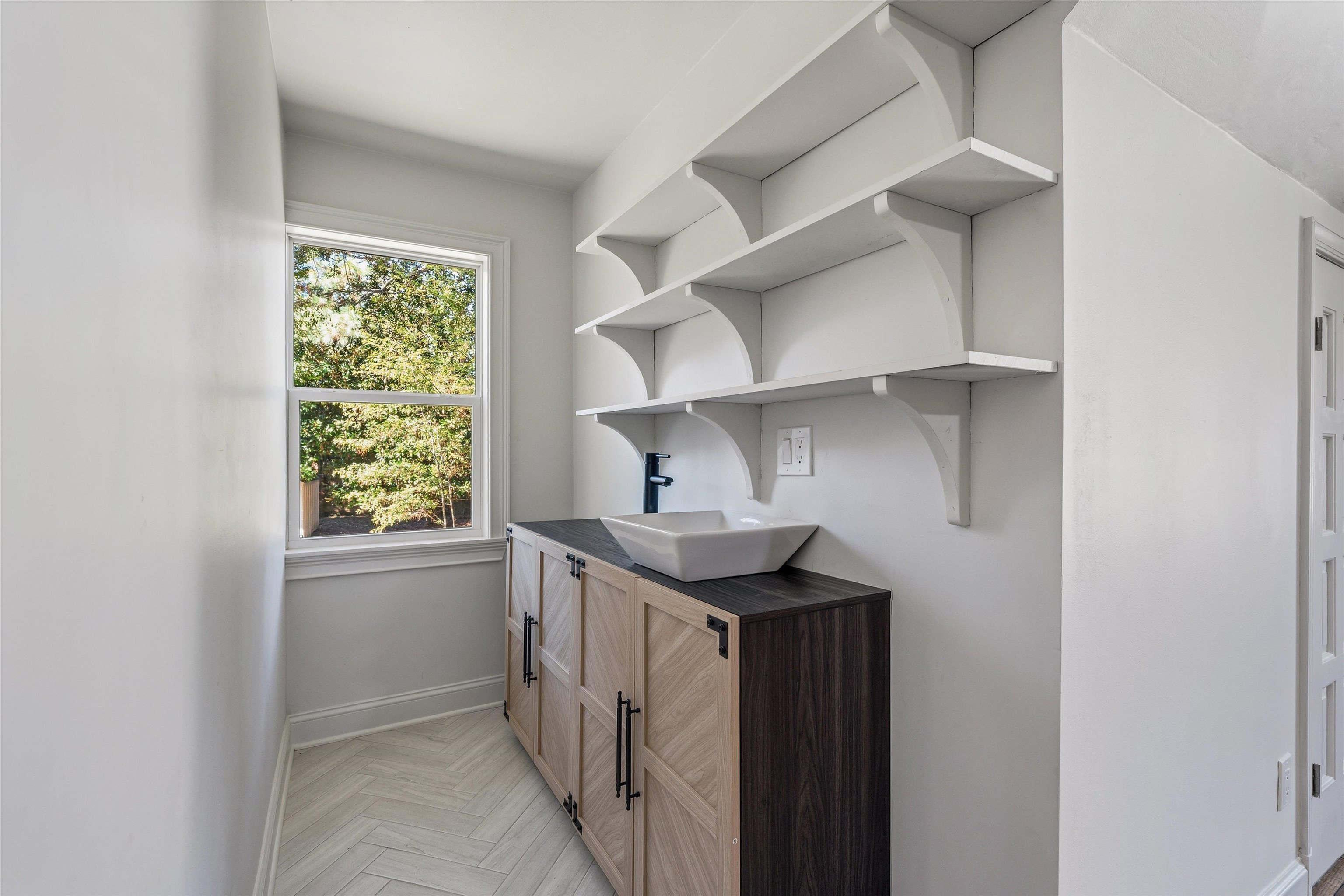 159 Perkins Extension Memphis, TN 38117 - Photo 31 of 37 a utility room with cabinets washer and dryer